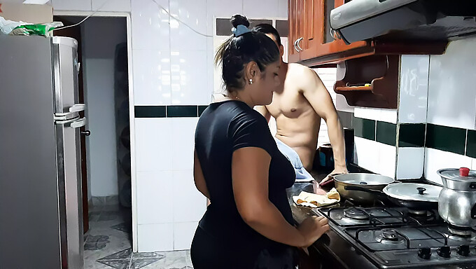 My mature stepmother performs an appetizing oral sex act on me in the kitchen